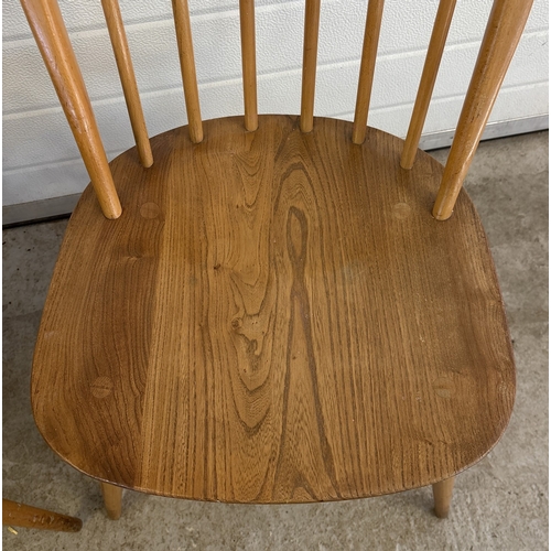 1430 - 2 vintage elm wood Windsor dinning chairs by Ercol, both with rust upholstered seat pads. Blue label... 