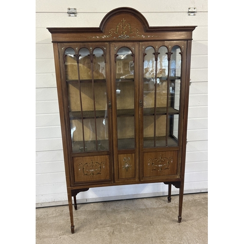 1431 - An Edwardian 2 door glass display cabinet with glazed & panel door, shaped top, tapered legs & spade... 