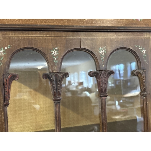 1431 - An Edwardian 2 door glass display cabinet with glazed & panel door, shaped top, tapered legs & spade... 