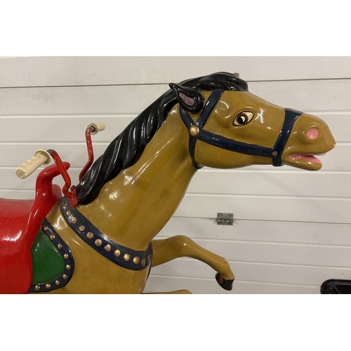 1434 - A vintage coin operated galloping horse amusement ride from Edward Savill amusements. Painted fibreg... 