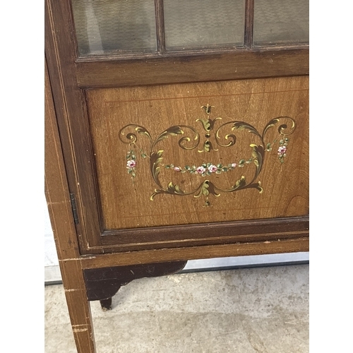 1431 - An Edwardian 2 door glass display cabinet with glazed & panel door, shaped top, tapered legs & spade... 