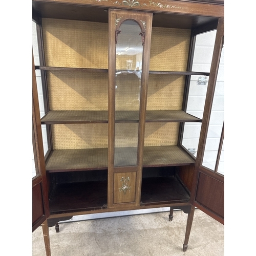 1431 - An Edwardian 2 door glass display cabinet with glazed & panel door, shaped top, tapered legs & spade... 