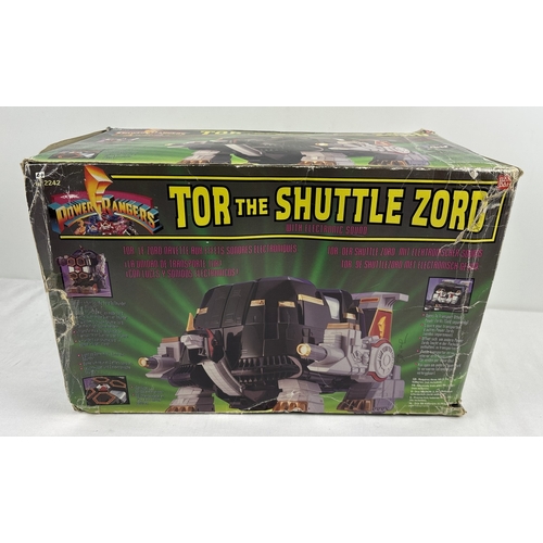 Mighty Morphin Power Rangers, Tor the Shuttle Zord from Bandai, 1994, comes with White Tiger Zord inside. Battery operated electronic Shuttle Zord comes with original box (tatty) and is missing horn and some decals.