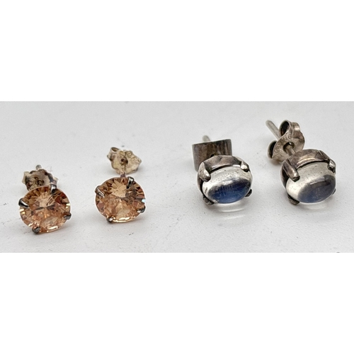 1255 - 6 pairs of silver and white metal studs style earrings. To include circular studs set with peach sto... 