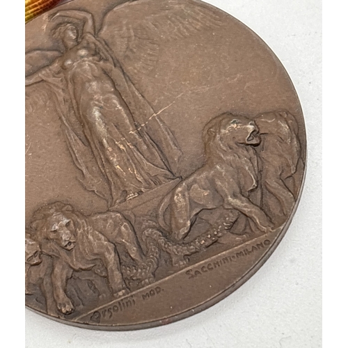 15 - A WWI Italian Inter-Allied Victory medal type 1 with original ribbon. Obverse shows winged Victory o... 