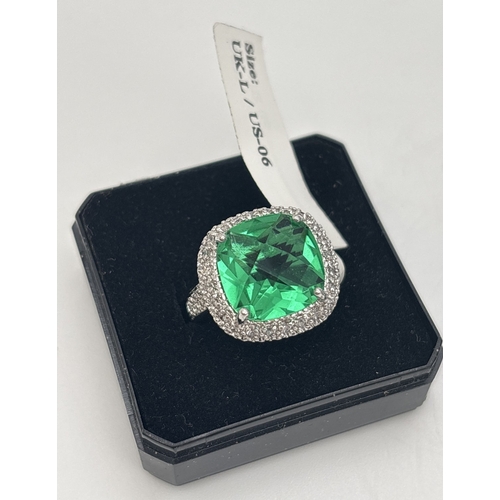 1025 - 4 boxed Cubic Zirconia stone set costume jewellery rings and ring sets by Giani. A square set green ... 