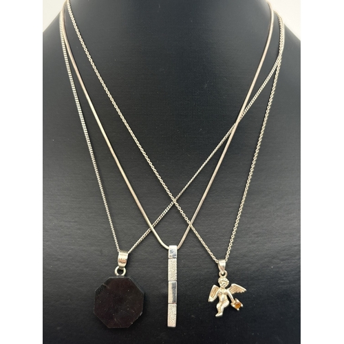 1041 - 3 silver pendant necklaces. A hexagonal black onyx pendant with silver hanging bale, on a 16