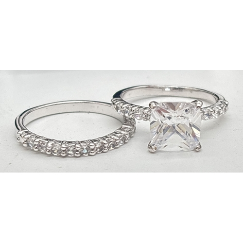 1053 - 3 boxed costume jewellery stone set rings together with a boxed ring set, all by Giani. A gold plate... 