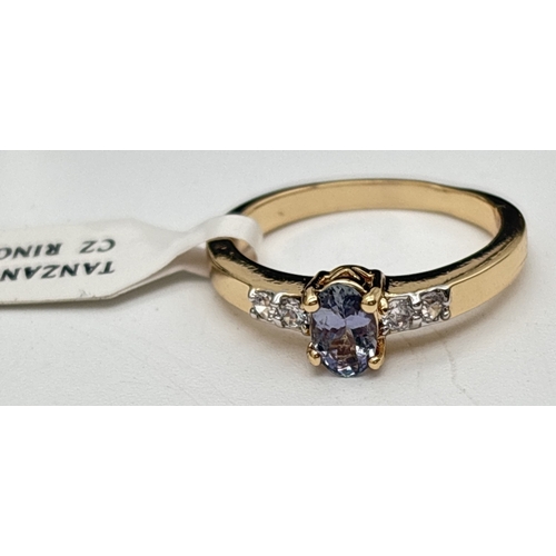 1053 - 3 boxed costume jewellery stone set rings together with a boxed ring set, all by Giani. A gold plate... 