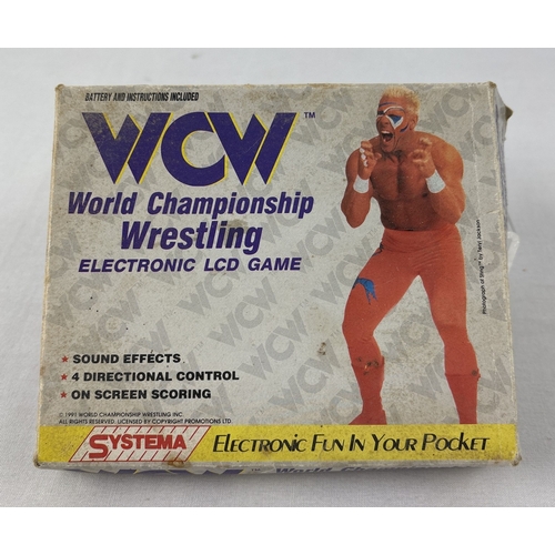 1 - A boxed 1991 WCW World Championship Wrestling Electronic LCD hand held game, with instructions. From... 