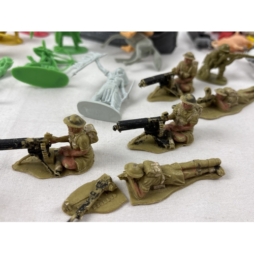 21 - A collection of vintage and modern plastic Cowboy & Indians, farm & wildlife animals, trees, fencing... 