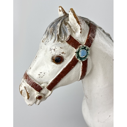 42 - A vintage 1950's child's push along/ride on horse by Tri-ang. A painted white hard plastic horse on ... 