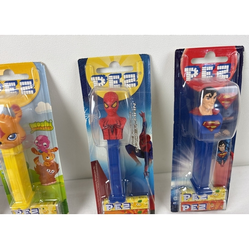 45 - 12 carded and 2 uncarded character Pez sweet dispensers. Comprising: Marg, Homer, Bart and Maggie Si... 