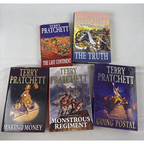 31 - A collection of 11 hardback and 14 paperback Terry Pratchett Discworld novels. All First Editions ap... 
