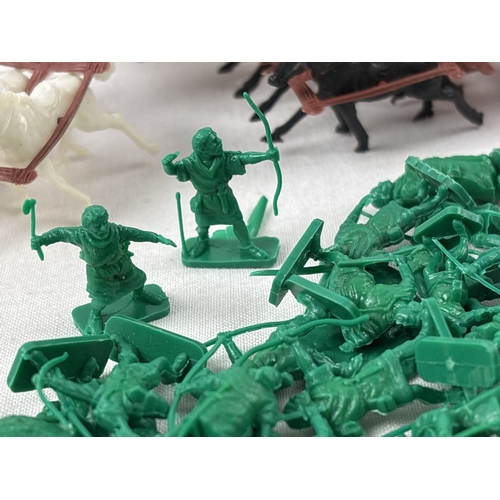 24 - A 1960's small plastic fort together with 2 sets of Knights and soldiers. Lot also includes 2 vintag... 