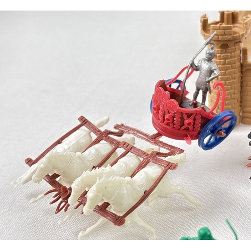 24 - A 1960's small plastic fort together with 2 sets of Knights and soldiers. Lot also includes 2 vintag... 