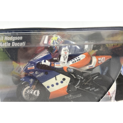 20 - 2 boxed Scalextric Moto GP motorcycles with riders. Valentino Rossi Repsol Honda C6000 together with... 