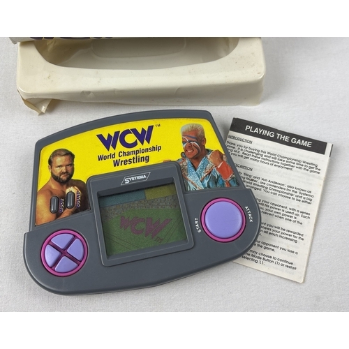 1 - A boxed 1991 WCW World Championship Wrestling Electronic LCD hand held game, with instructions. From... 