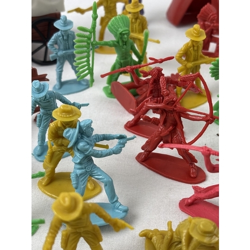 21 - A collection of vintage and modern plastic Cowboy & Indians, farm & wildlife animals, trees, fencing... 