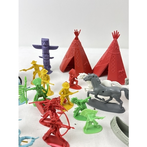 21 - A collection of vintage and modern plastic Cowboy & Indians, farm & wildlife animals, trees, fencing... 