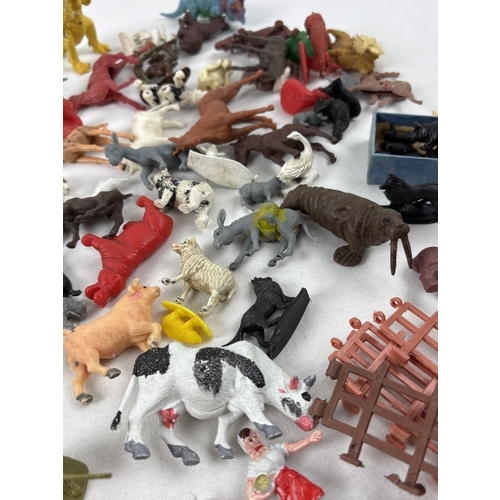21 - A collection of vintage and modern plastic Cowboy & Indians, farm & wildlife animals, trees, fencing... 