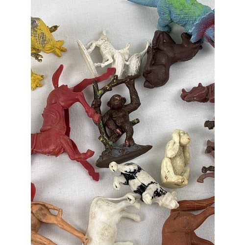 21 - A collection of vintage and modern plastic Cowboy & Indians, farm & wildlife animals, trees, fencing... 