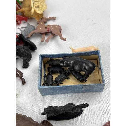 21 - A collection of vintage and modern plastic Cowboy & Indians, farm & wildlife animals, trees, fencing... 