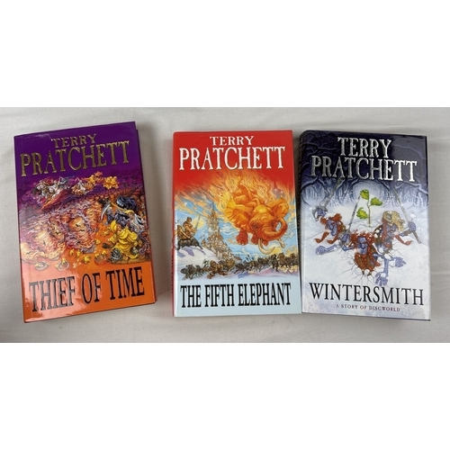31 - A collection of 11 hardback and 14 paperback Terry Pratchett Discworld novels. All First Editions ap... 