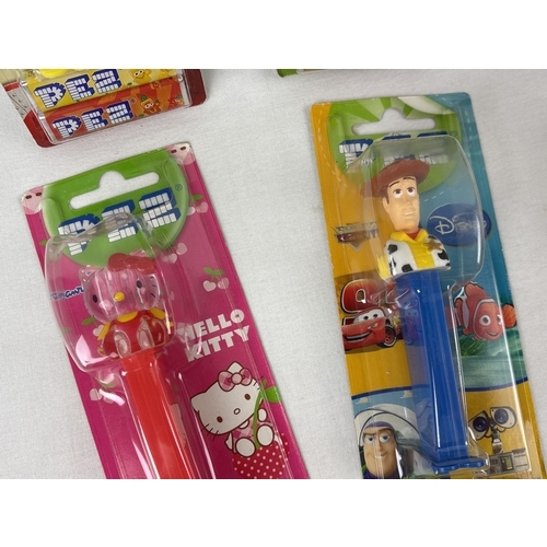 45 - 12 carded and 2 uncarded character Pez sweet dispensers. Comprising: Marg, Homer, Bart and Maggie Si... 