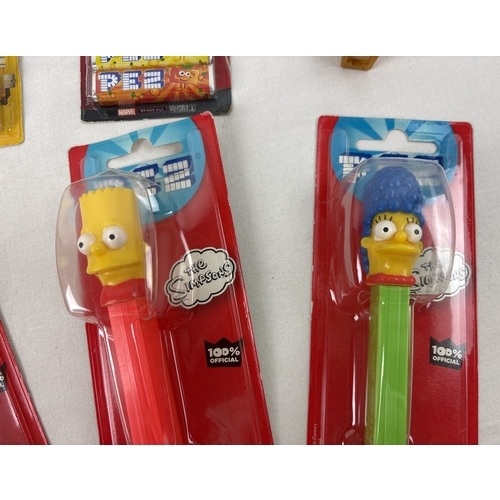 45 - 12 carded and 2 uncarded character Pez sweet dispensers. Comprising: Marg, Homer, Bart and Maggie Si... 