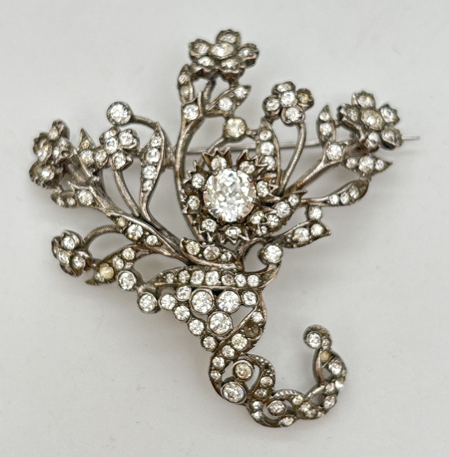 A large vintage silver floral spray design brooch set with multiple ...