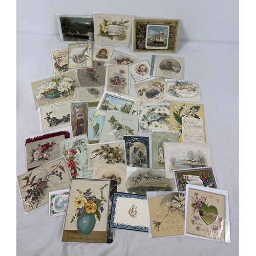 A collection of 200 assorted antique greetings cards in varying sizes ...
