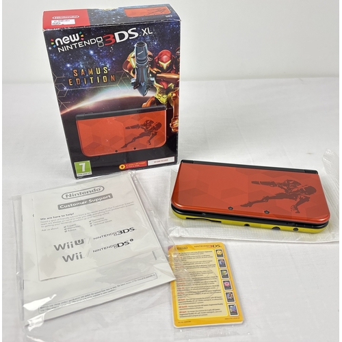 A boxed Samus Metroid edition Nintendo 3DS XL handheld console, European version, in mint condition. Comes with stylus, manual and sealed AR cards. Box has some damage to one corner.