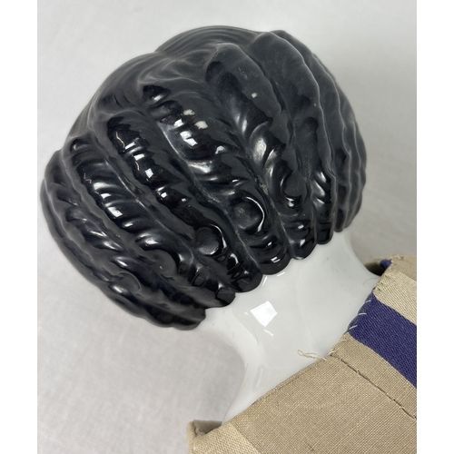 259 - A large antique ceramic head French doll with soft body and ceramic arms and legs. With hand painted... 