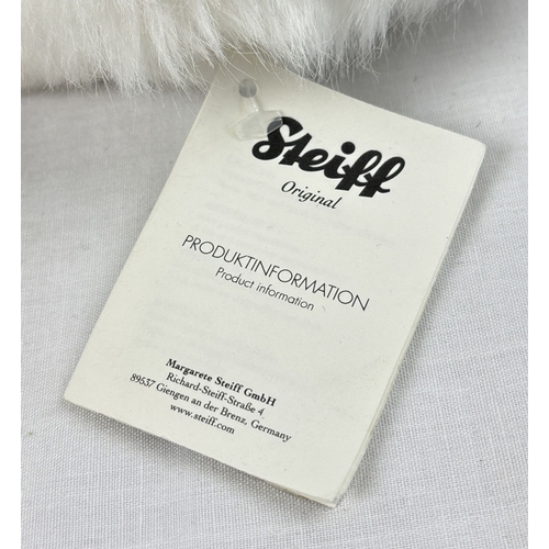 262 - Steiff #077968 Niklas Arctic Hare Plush toy with white original label, booklet and button attached. ... 