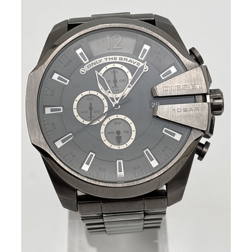 A Men's DZ-4282 11712 Only The Brave chronograph wristwatch by Diesel. Gunmetal grey stainless steel strap and case with dark grey dial and silver accents to secondary dials and hour markers. In working order.