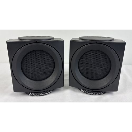 1265 - A pair of Wharfedale Modus surround sound bookshelf cube speakers, in black. Each approx. 16cm tall.