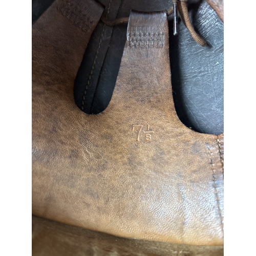 1266 - A World War II era leather pudding basin motorcycle helmet with integral leather neck, ear flaps and... 