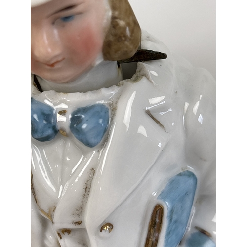 1329 - 6 assorted antique bisque nodder figurines in varying designs and colours, to include a pair in yell... 