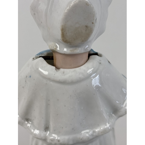 1329 - 6 assorted antique bisque nodder figurines in varying designs and colours, to include a pair in yell... 