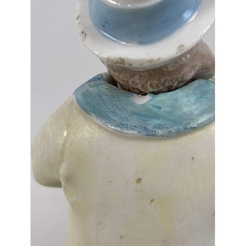 1329 - 6 assorted antique bisque nodder figurines in varying designs and colours, to include a pair in yell... 