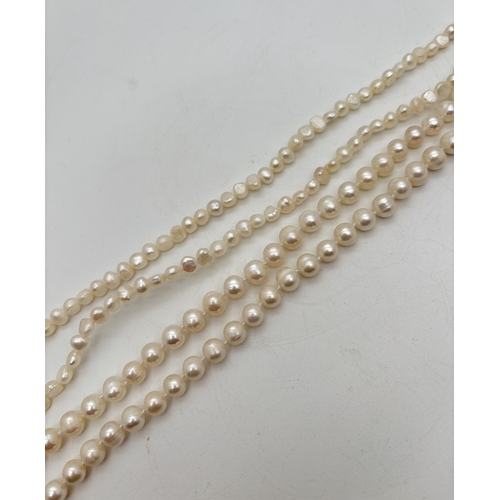 2 strings of freshwater cream lustre pearls. A string of smaller ...