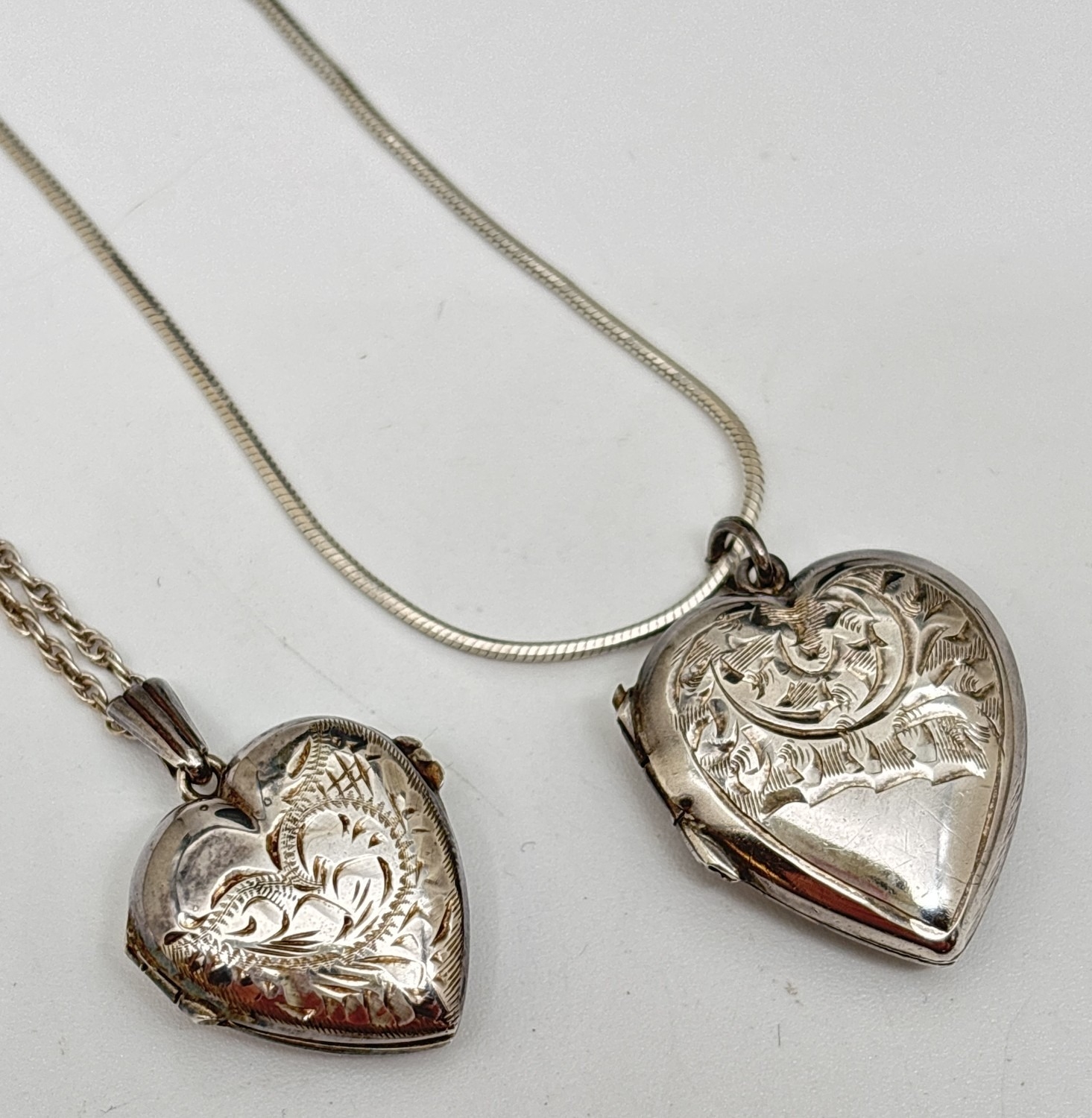 2 vintage silver heart shaped locket necklaces. A locket with half ...