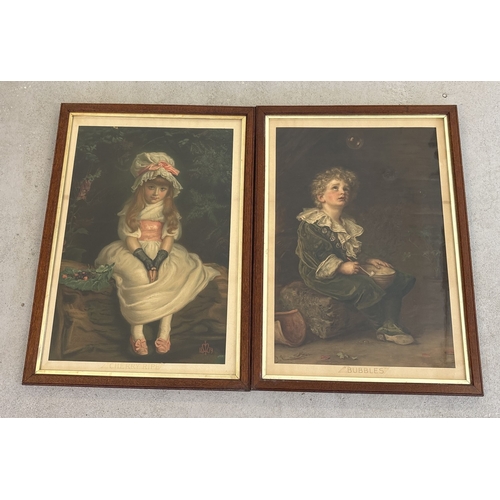 A large pair of vintage Pears prints, "Bubbles" and "Cherry Ripe", in early 20th century dark oak frames. Frame sizes approx. 86cm x 62cm. Print sizes approx. 72cm x 48.5cm.