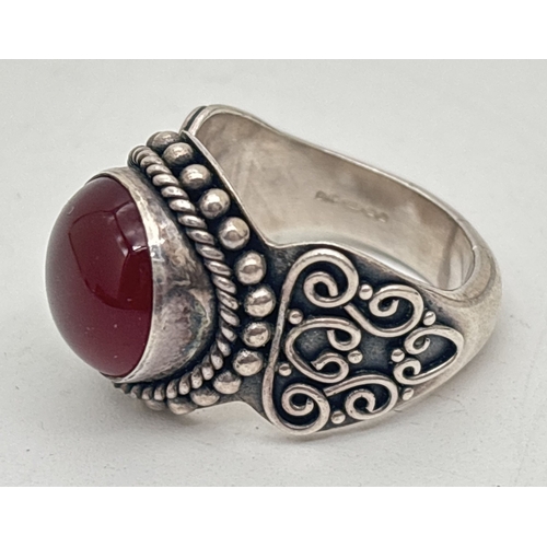 2 ethnic design stone set rings. A silver ethnic style ring by Suarti ...