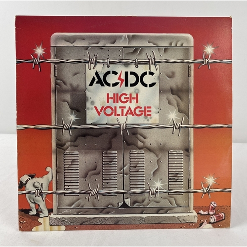 AC/DC - High Voltage rare 1977 debut album Australian 8-track vinyl LP with original vocalist Bon Scott. Label variant with no kangaroo, track A1 writing credit corrected from Broonzy to Joe Williams but still credited on the back sleeve to Broonzy.