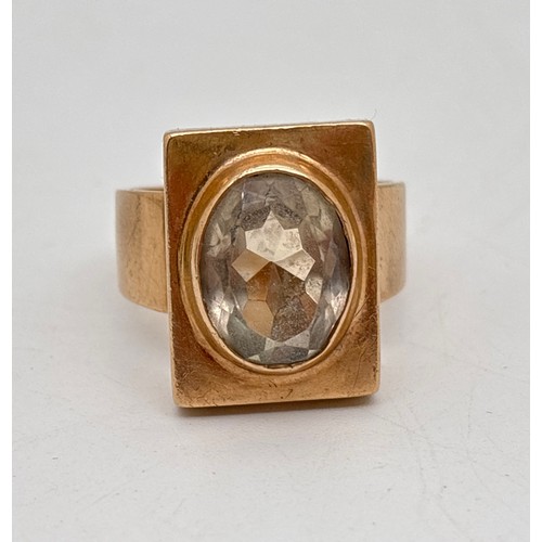 A large 9ct gold & aquamarine rectangular mount ring with wide band and set with a large oval cut aquamarine. Fully hallmarked inside band. Ring size Z +2. Total weight approx. 13.6g.