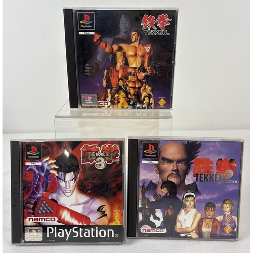 49 - 3 cased PlayStation 1 games - Tekken, Tekken 2 and Tekken 3, by Namco, all with manuals. Cases in ex... 