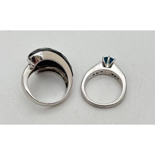 1034 - 2 silver modern design rings. An organic shaped ring set with a piece of checkerboard cut black onyx... 
