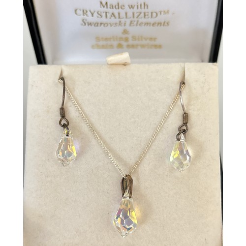 1051 - 2 boxed pendant necklaces, one with matching earrings. A silver dolphin pendant on a 16